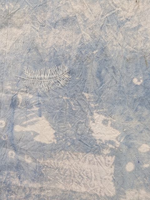 Sewn feathers on dyed and bleached calico